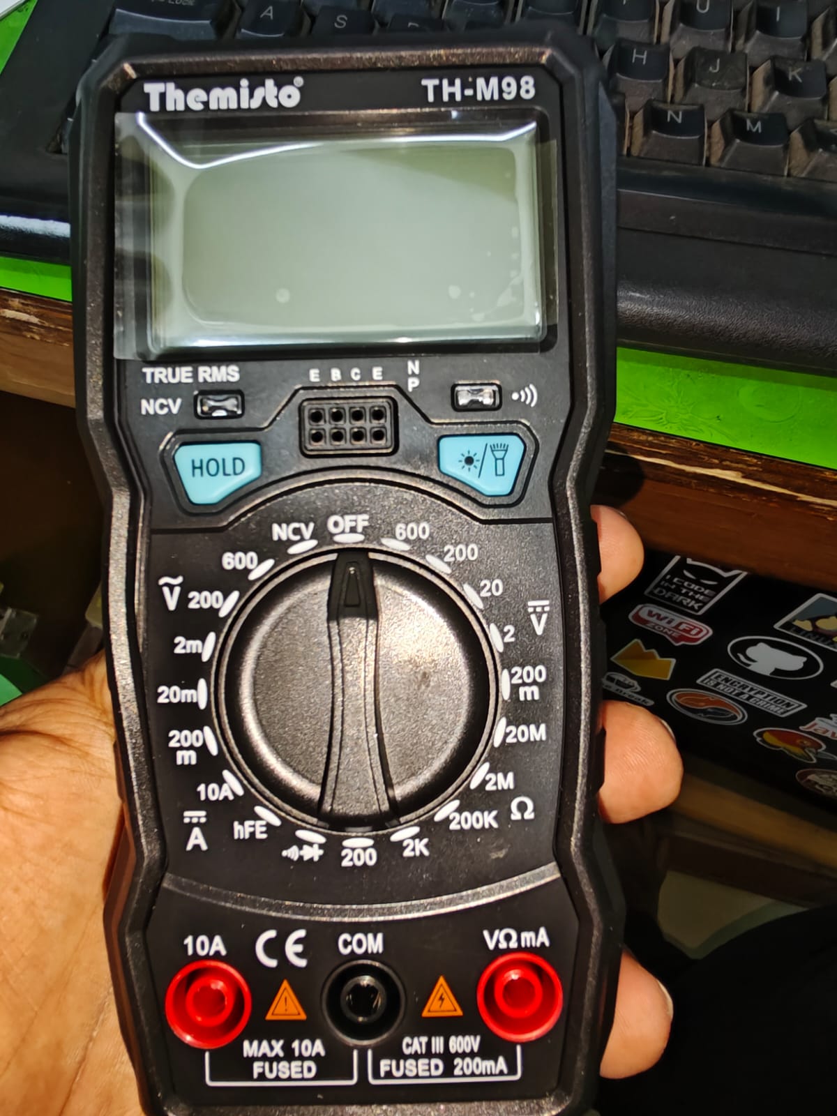 Themisto TH-M98 front face — dial and ports visible